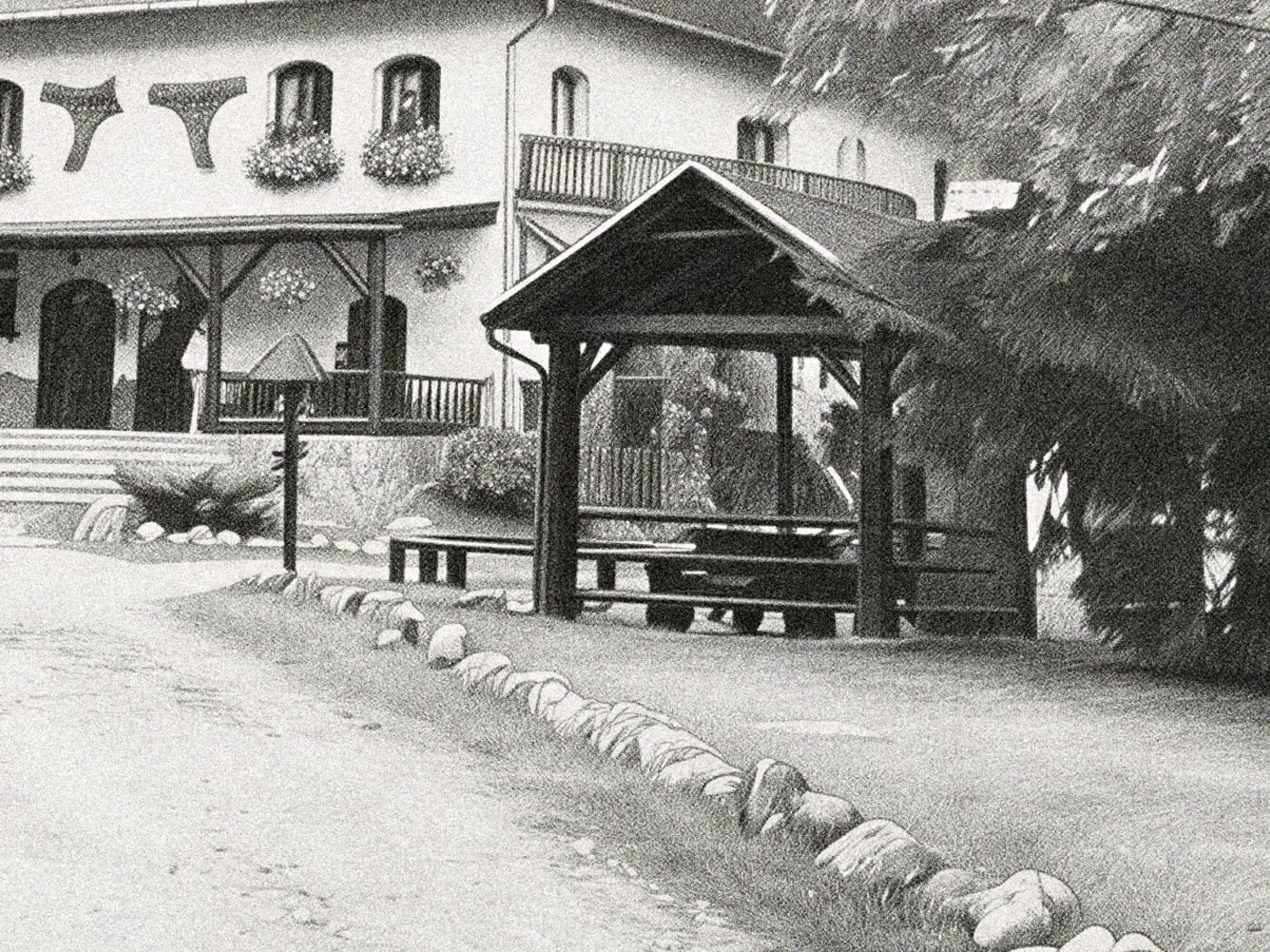The same drawing up close: the guesthouse porch and a timber picnic shelter, down to the flower boxes